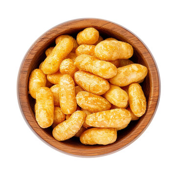 Peanut flips, in a wooden bowl. Also known as Bamba, peanut puffs or snips, is a puffed, peanut-flavored corn snack, with a peanut content up to a third. Close-up, from above, isolated, macro photo.