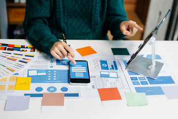 UX graphic designer planning application process development prototype wireframe for web smart phone. Creative digital development
