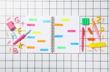 Notebook and stationery on the table, top view.