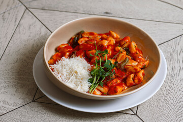 Tortellini pasta with tomato sauce and parmesan cheese