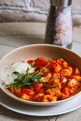 Tortellini pasta with tomato sauce and parmesan cheese