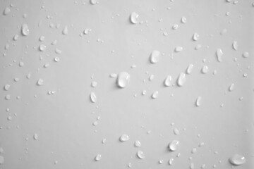 Water drops on white wall background texture