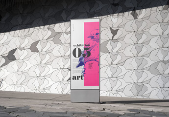 Mockup of customized poster against patterned wall