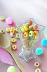 KId's Breakfast Fruit Loops Cereal in Star Shape Cup on Pink Background