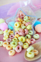 Pile of Colorful Fruit Loops in Star Shape Cup