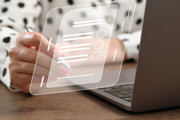 Woman signing electronic document at table, closeup. Virtual screen over laptop