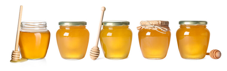 Natural honey in glass jars and dippers isolated on white, set