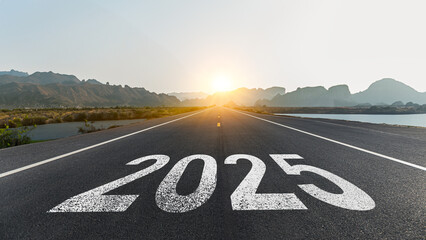 New year 2025 or straight forward concept. Text 2025 written on the road in the middle of asphalt...