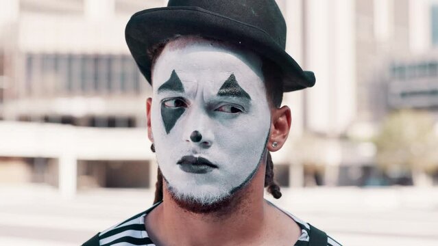 Thinking, mime and face of man in city for funny joke, humor and crazy facial expression. Theatre, street performer and portrait of person with paint mask for performance, entertainment and comedy