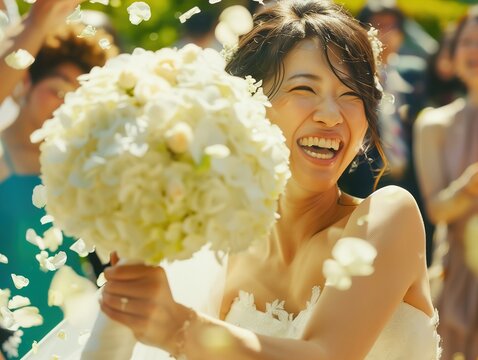 Bride in Wedding Dress Holding Bouquet of Flowers