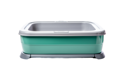 A green and grey plastic litter box sits quietly, awaiting its next occupant