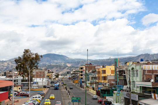 urban street view of riobamba, ecuador with andean backdrop