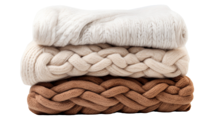 Three different colored blankets stacked neatly on top of each other