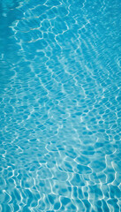 Obraz premium A close-up of the rippling and sparkling water surface of the pool seen from directly above. 真上から見た一面の波打って輝くプールの水面のクローズアップ