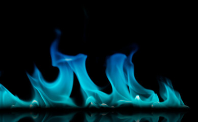 Blurred image of blue flames on a black background.