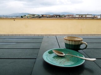 Coffee cup and saucer on the terrace of a restaurant
