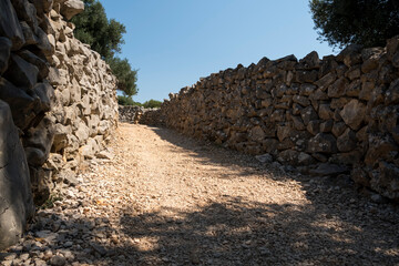 Ground road between walls made of stone