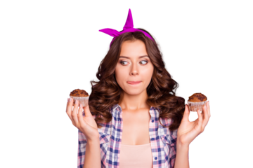 Portrait of nice positive girlish attractive funny wavy-haired lady wearing checkered shirt holding in hands two fresh muffins licking lips isolated over violet pastel background