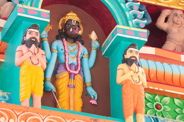 Obraz na płótnie Canvas Varaha, embodiment of Vishnu avatar on the wall of a Hindu temple and Rishi sages.
