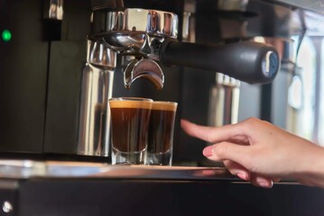 woman barista making a coffee