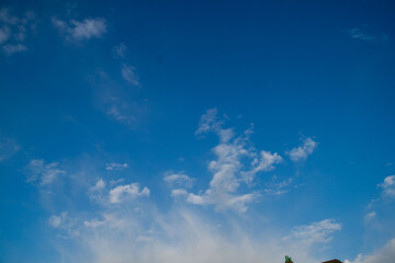 Clouds in the blue sky on a sunny day. Sunny sky background