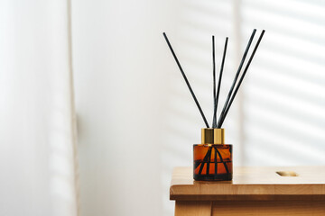 Elegant Reed Diffusers on Wooden Surface With Soft Background Light
