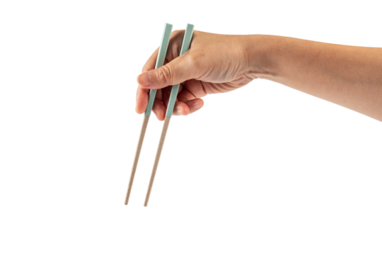 Hand holding chopsticks isolated on a transparent background
