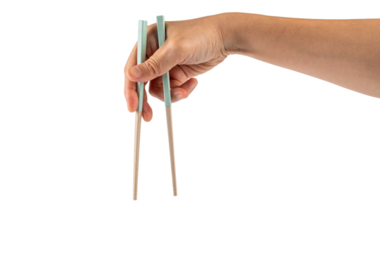 Hand holding chopsticks isolated on a transparent background