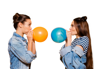 Photo portrait of two brunette hair lady look to each other blow fly ball stand isolated on yellow shine background make staring eyes big cheeks