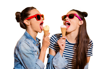 Two cute gorgeous nice adorable good-looking nice-looking brunette hair lady in glasses spectacles eating sugar yummy delicious sweet appetiser snack isolated on yellow wall