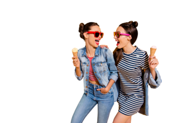 Photo of two brunette hair lady in glasses spectacles isolated on yellow background hold sugar tasty yummy delicious sweet appetiser snack in hands look each other make beaming hollywood toothy smile