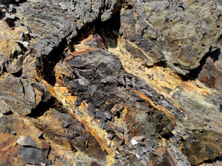 Geodesy. Stone texture. The rock is brown and red. Mineral background. Design from natural materials.