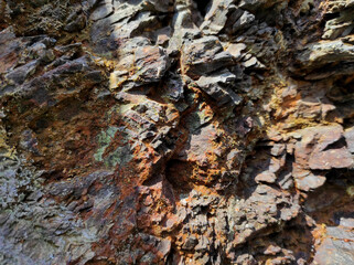 Geodesy. Stone texture. The rock is brown and red. Mineral background. Design from natural materials.