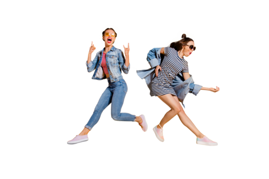 Full legs body size beautiful gorgeous adorable two lady isolated on yellow background in trendy casual street style stylish denim jeans wear glasses spectacles give heavy metal gesture play guitar