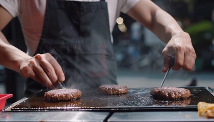 Person Cooking Hamburgers on Grill