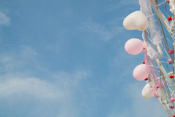 Balls and flowers on sky background. inflatable balloons on sky background