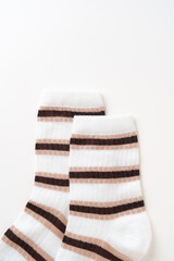 Striped socks for kids on white background