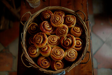 Aesthetic image of homemade cinnamon rolls neatly arranged in a rustic basket, invoking a cozy, comforting vibe