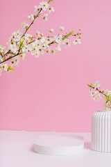 Empty podium or pedestal with spring bloom. Mock up for cosmetic products