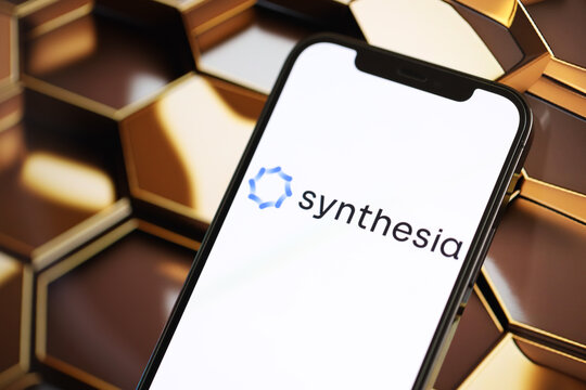 KYIV, UKRAINE - MARCH 17, 2024 Synthesia logo on iPhone display screen with background of artificial intelligence futuristic ai generated image close up