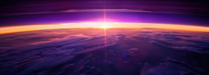 View of the purple and orange light through the earth's horizon.