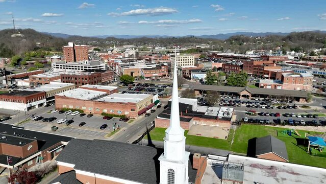 church steeple in foreground aerial in johnson city tennessee