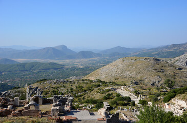 a mountain range with a blue sky and ruins of ancient town Sagalassos  