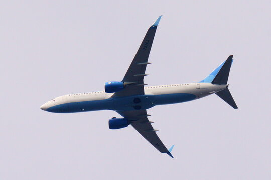 Belarus, Minsk region. March 30, 2024. Pobeda Airlines plane. Boeing 737-800. Board number: RA-73303. View from below.
