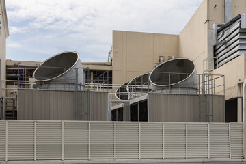 Cooling towers in data center building. Air conditioning cooling towers in front of building with...