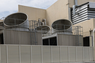 Cooling towers in data center building. Air conditioning cooling towers in front of building with...