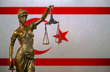 Obraz premium Lady Justice before a flag of Northern Cyprus