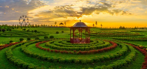 Tuinposter Tranquil Haven: Aerial Perspective of Park Gazebo © maykal