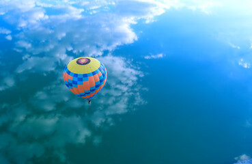 Afloat Adventure: Balloon Drifting Over the Water - 773934491