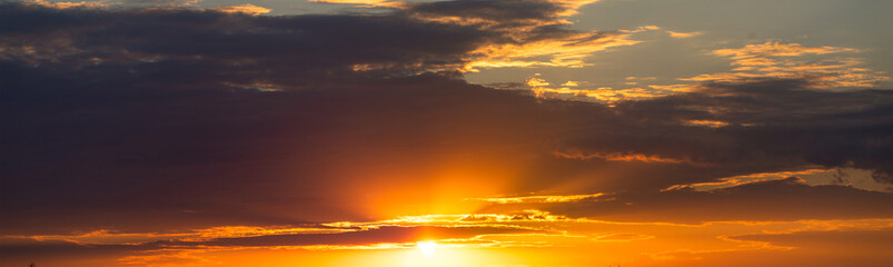 Sunset Reverie: Evening Cloudscape Under the Setting Sun - 773935063